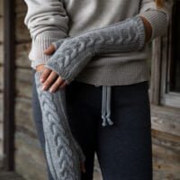 grey woolen mittens with braids