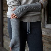 grey woolen mittens with braids